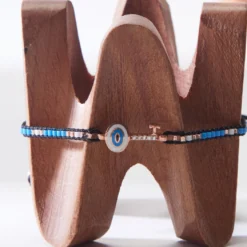 EVIL EYE KEY BRACELET WITH MULTI COLORED BEADS ON SILK ROPE